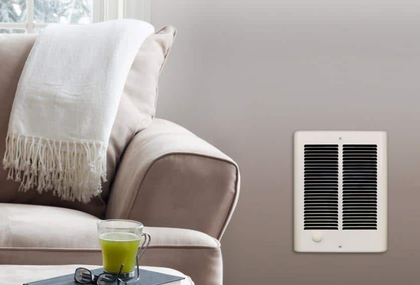 A white wall heater beside a cozy couch in a living room setting.